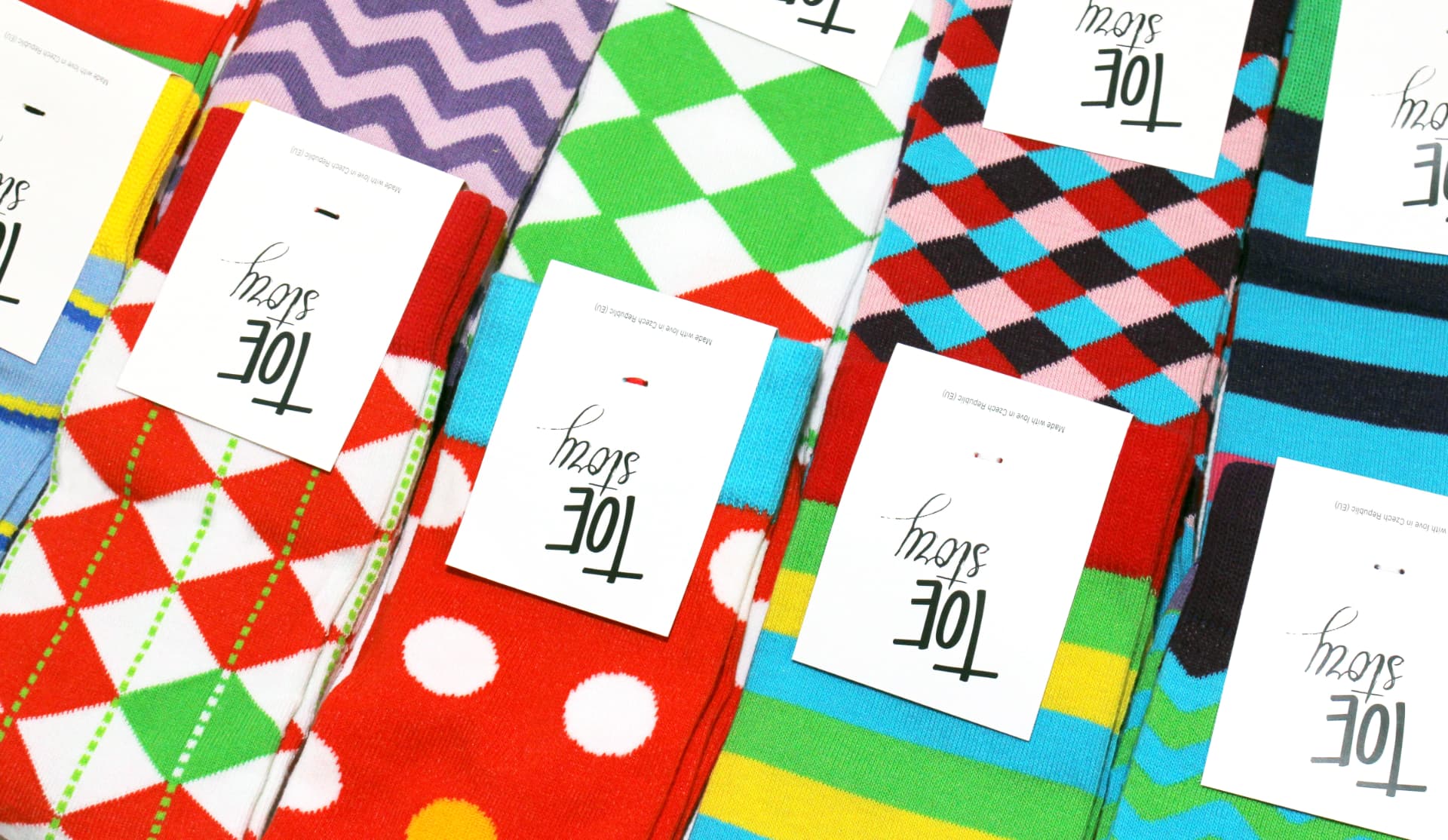 Rows of colorful Toe Story socks with argyle, dot, stripe and zigzag patterns