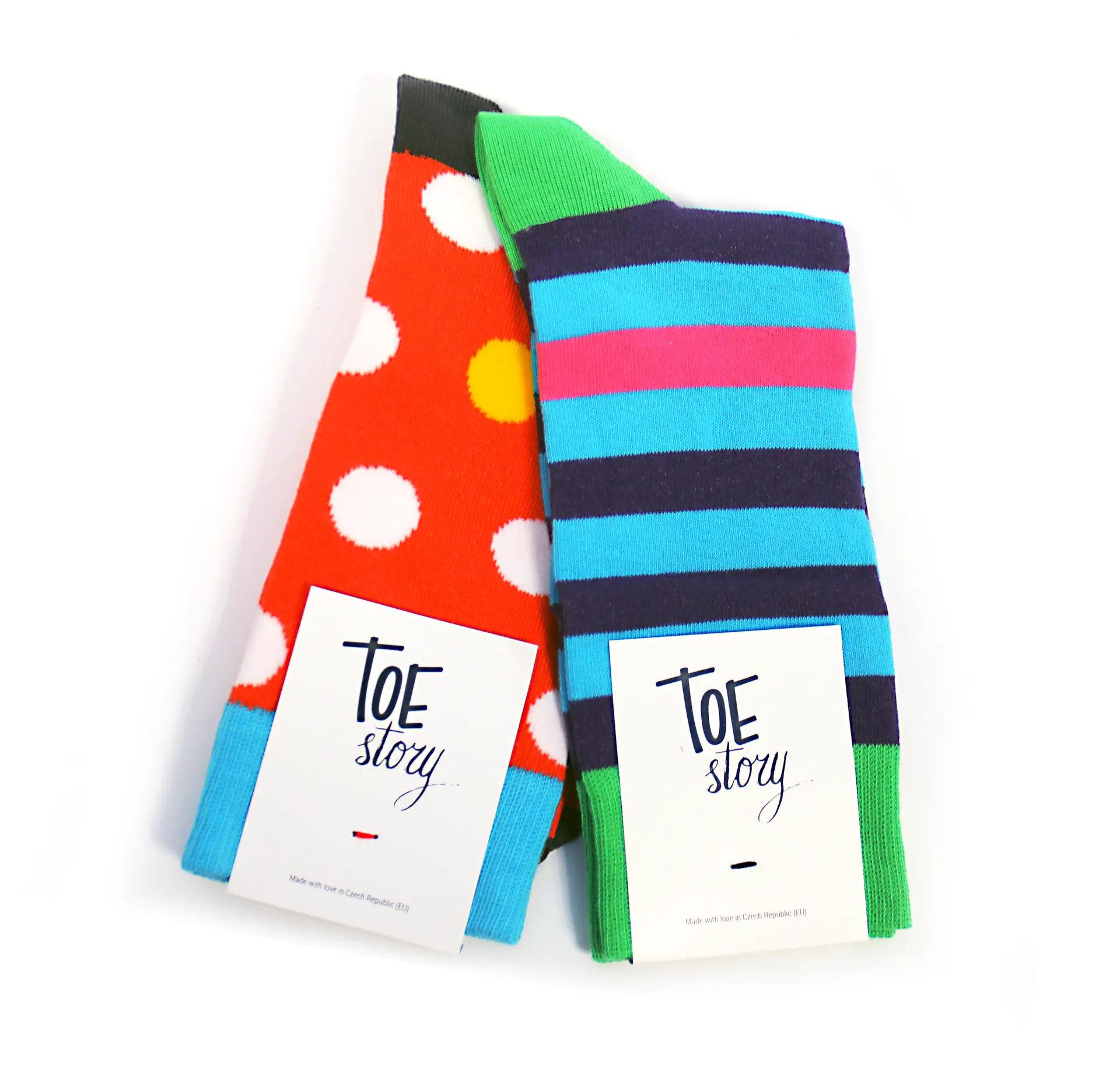 Red polka dot socks and striped socks with Toe Story labels